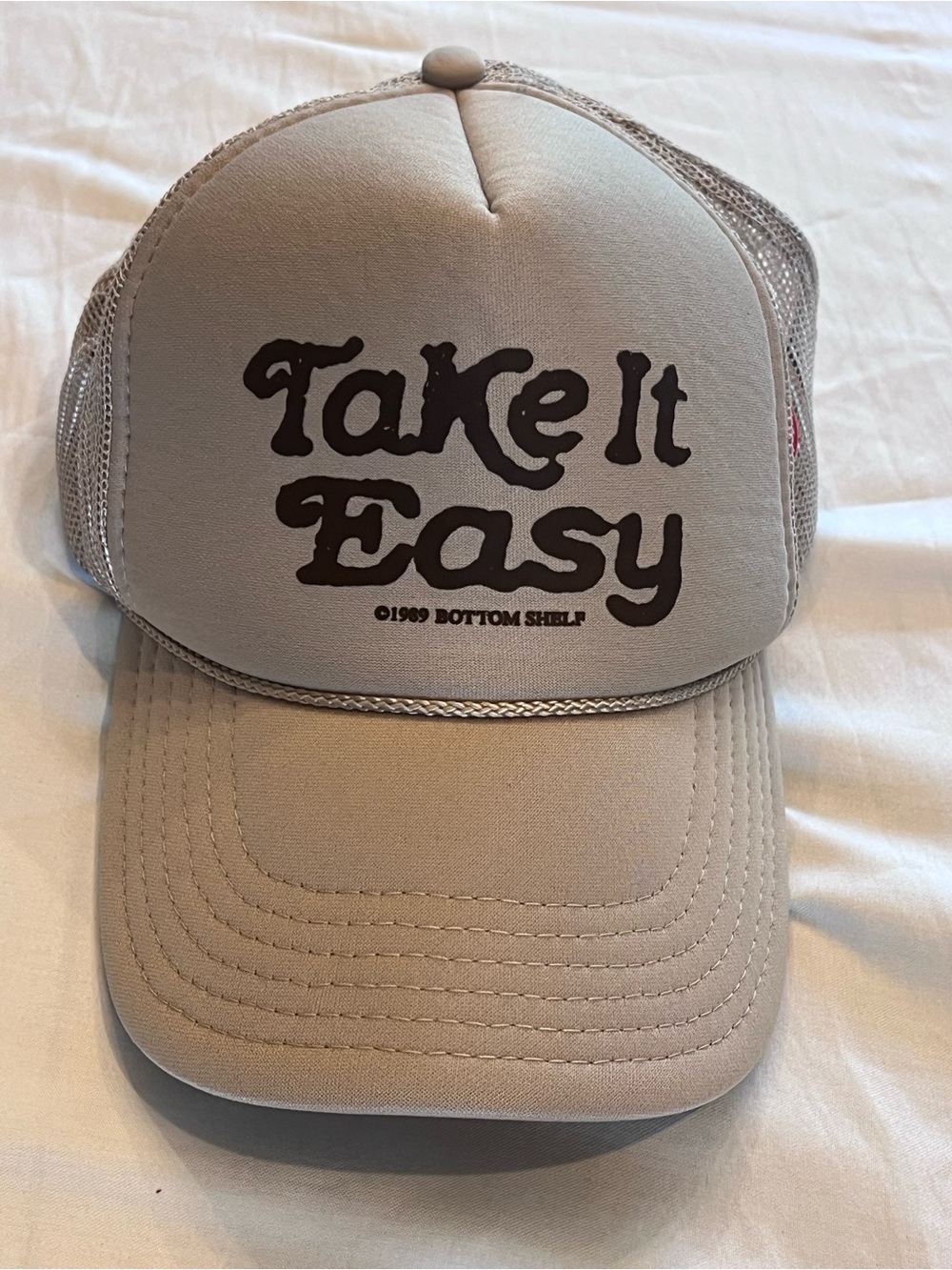 OTTO Beige Trucker Hat with 'Take It Easy' Script and Pin on side